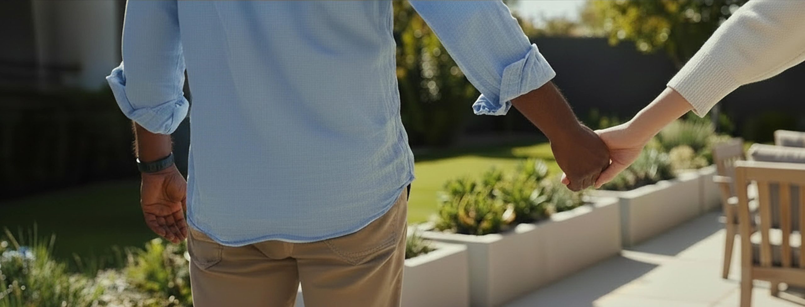 Photo of a man and woman holding hands