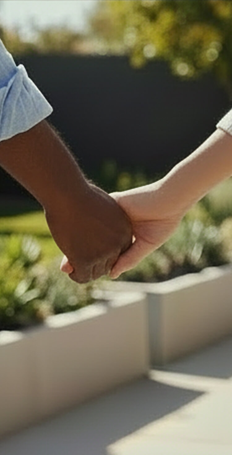 Photo of a man and woman holding hands